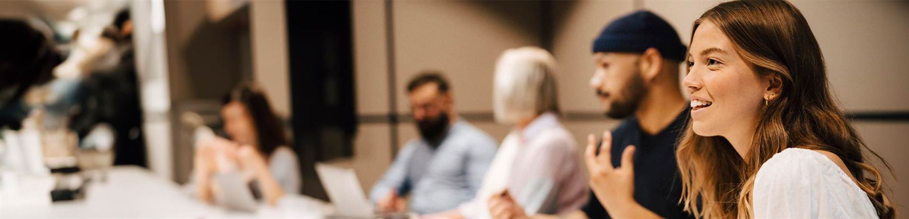 Female listening to feedback in a meeting