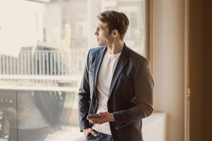 Business man looking out a window