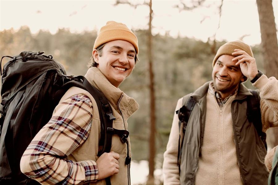 Woman biking by a train