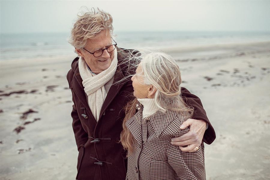Senior couple walking on the beach